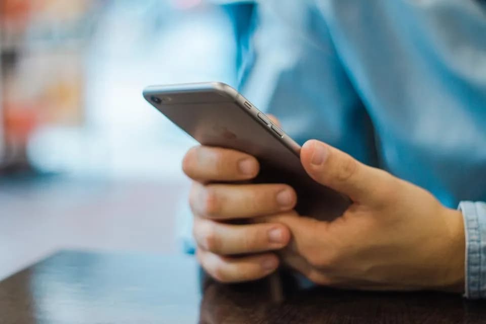 Person searching for a local law firm on a smartphone