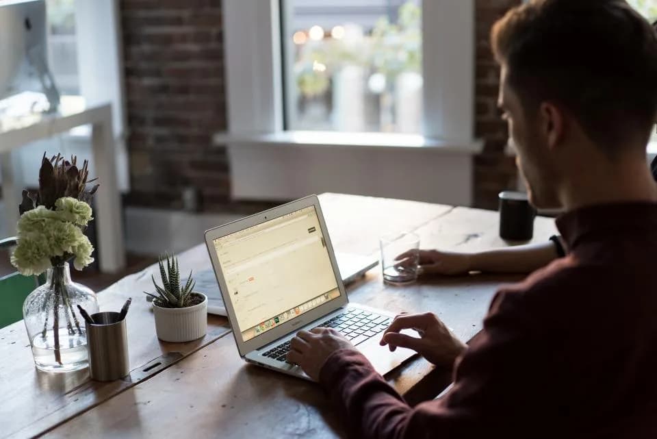 Personal injury attorney reviewing case material at a laptop