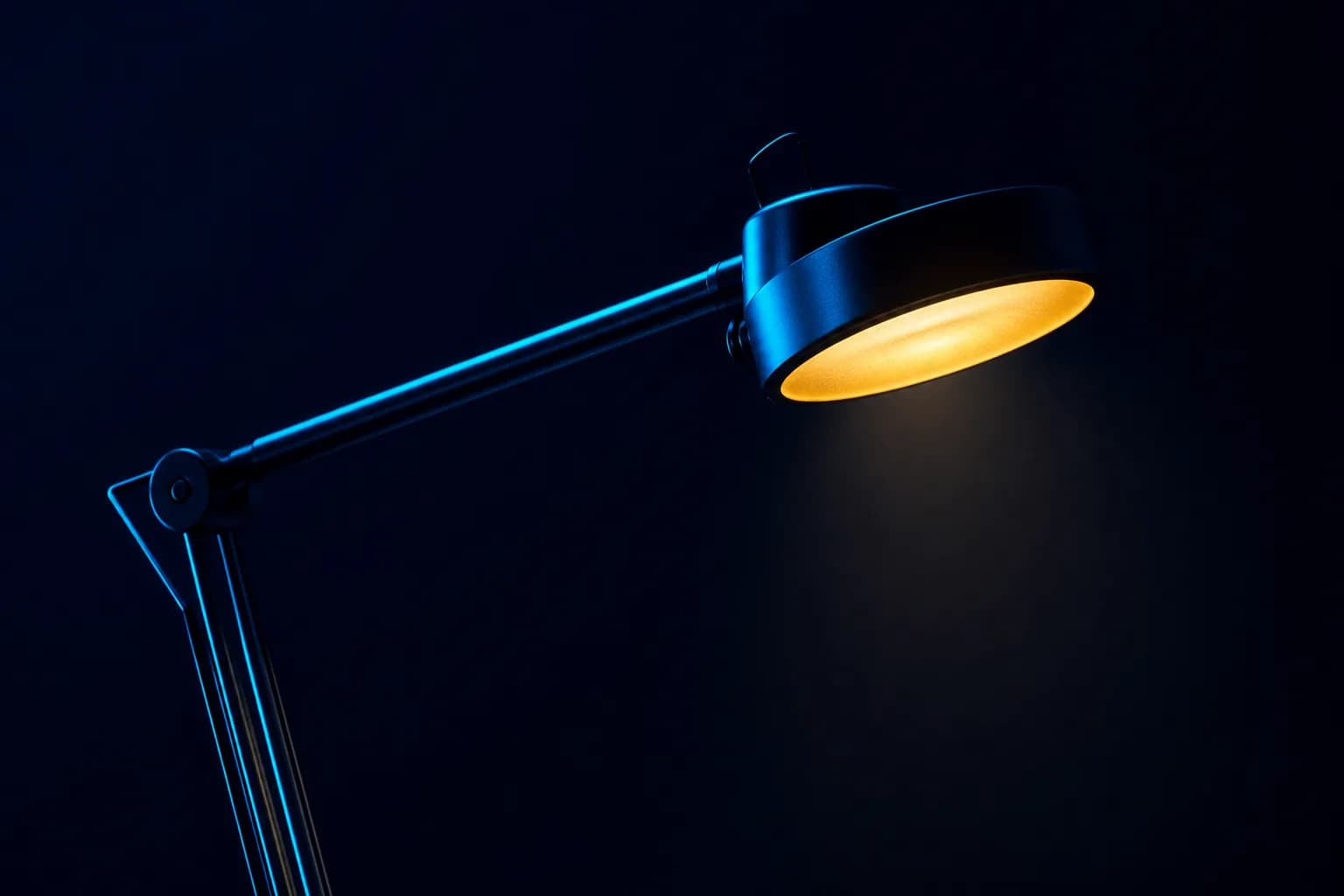 An articulated examination lamp silhouetted against a dark navy wall, its head glowing warm gold, careful scrutiny of every claim