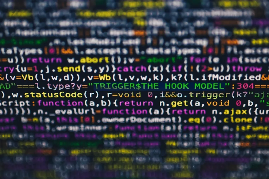 Close-up of colorful syntax highlighted JavaScript source code filling a computer screen
